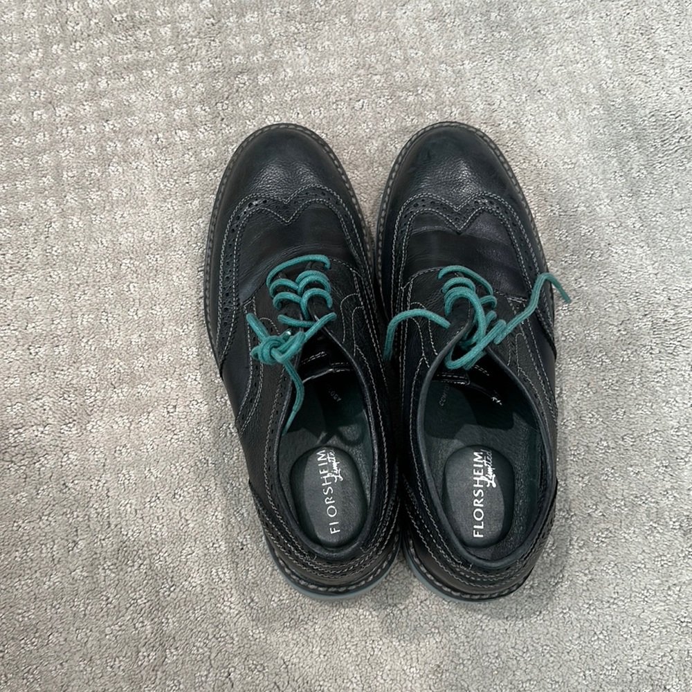 Men’s black wingtip florsheim shoes teal laces